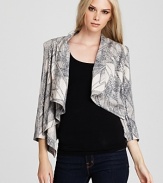 Add instant modern elegance to every look with this GUESS printed jacket, cut in a gorgeously draped silhouette.