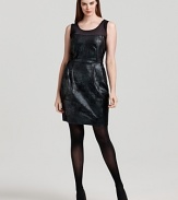 A sheer neckline shows off the décolleté, while alluring metallic snake print lends an exotic feel to this fête-ready DKNYC dress.