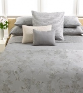 Serene sophistication. This Regent Damask coverlet from Calvin Klein provides a luxurious layer on your bed.