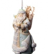 Santa Clause carries a snow globe and basket of gifts in this Nature Santa ornament, featuring detailed leaf and crystal embellishments upon his traditional robe.