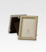 A keepsake accent for life's favorite moments and people, upholstered in smooth leather with 14k gold- or platinum-plating and glimmering Swarovski crystals. Accommodates a 2 X 3 photograph Hand wipe Imported