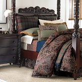 The casual camaraderie of long weekends spent with family and friends is articulated with warmth in a wardrobe of time-honored tartans and heathered tweeds. Highlighting the assembly is a feathery paisley updated with a surprising accent of bright blue that reappears on a lambswool blanket interwoven with an overscaled burgundy windowpane check. Twisted yarn fringes all sides of wool plaid shams. Tweed wool shams are bound with diamond-quilted ginger suede flanges. Cream tattersall sheets have deep upturned hems with double-needle topstitching. Wool throw pillows reiterate complementary plaids; each is uniquely finished in smooth leather, jacquard ribbon or dobby tape.
