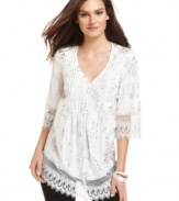A metallic floral print adds shine to this Alfani tunic for a stylish summer look!