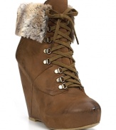 Faux fur lining softens these rugged lace-up booties for sky-high chic when temperatures fall. By Boutique 9.