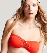 Get a little color with Juicy Couture's cinched bandeau top. In a vivid orange hue, this style packs a plunge worthy pop with a sheer kaftan and pair of flat sandals.