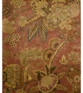 Luminous desert blossoms cascade across a fiery red ground in the Rajah area rug from Nourison, creating a warm and inviting update made for any style decor. Crafted in India of sumptuous New Zealand wool pile for incredible color-recognition, design clarity and a luxuriously soft feel.