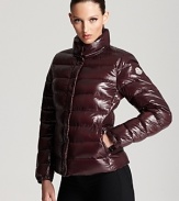 In rich burgundy and a lacquered finish, this classic Moncler puffer keeps out the cold in French aprés ski style.