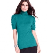 Style&co. ruched the sleeves of this fitted turtleneck sweater for a femme finishing touch.