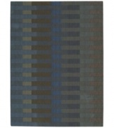 The Calvin Klein Loom Select Rug Collection offers a modern design approach to floor coverings with an emphasis on distinct colors and subtle textures. Woven in plush wool with refined accents of hand carving, these rugs provide a dense and luxurious texture, while a soft patina imbues each carpet with distinct depth and design distinction. This rug features a linear block pattern in muted blues and grays, adding modern versatility for your home.