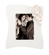 Sculpted gardenias pop with a tinge of pink against this glossy white Flora picture frame. A vision of romance in graceful Lenox porcelain. Qualifies for Rebate