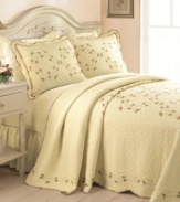 Budding beauty. Delicate embroidered rosebuds meander upon vermicelli-stitched quilted cotton for a look of timeless elegance. Finished with scalloped edges and rose-print trim.