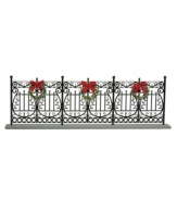 Arrange the Byers' Choice figurines in front of this faux wrought-iron fence. With traditional detail and pretty Christmas wreaths, it helps create a beautiful holiday scene.