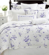 Style is in bloom with Martha Stewart Collection's Trousseau Violets embroidered pillowcases, featuring elegantly embroidered white blossoms on a field of soft cotton.