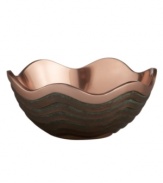 Featuring a bold new look for Nambe's signature metal, the Copper Canyon bowl captures the striking beauty of the American southwest in brilliant copper. A rippled shape inspired by the region's wind- and water-worn canyons is finished with a rustic green patina.