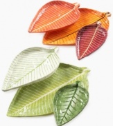 Nesting Leaf trays serve great purpose in your home and for the artist, Moro of Jacmel. Orange and red leaves made of recycled paper to resemble the Caribbean nation's autumn foliage are ideal for serving dry goods and organizing trinkets on a console or coffee table.