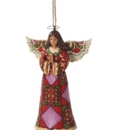 A distinct quilt pattern in red, plum and green make this praying angel ornament more striking than serene, and undeniably beautiful. With the unique folk-art style of Jim Shore.
