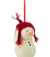 A smiling face peers up from underneath a red stocking cap in an ornament that begs for friendship. A sweet gift in porcelain bisque from Department 56.