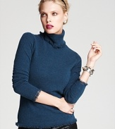 Ease into the new season with spiced-up versions of your favorite closet essentials. This Magaschoni turtleneck is decorated by textured fringe for the perfect touch of bohemian-chic.