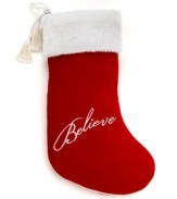 Show you believe. A plush white cuff, red boot and elegant rope and tassel trim make this quintessential Christmas stocking a festive addition to any holiday home.