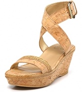 Natural cork gets adorned with woven trim, exuding earthy style in a chic silhouette. From Stuart Weitzman.