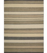 Variegated striping gives way to understated sophistication in the Horizon area rug from Calvin Klein. Generously thick wool fibers are hand tufted in India for remarkable strength and detailed design.