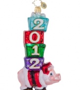 What a ham. Wearing a Santa suit and shoes, this jolly pig ornament mixes country charm and holiday whimsy in mouth-blown, hand-painted glass. From Christopher Radko.