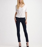 Dark wash in clingy stretch denim leggings.THE FITBody-hugging fit from waist to ankle Mid rise Inseam, about 31THE DETAILSZip fly Button waist with belt loops Front scoop pockets and patch coin pocket with rivets Back patch pockets Signature patch at waist 44% rayon/29% cotton/25% cupro/2% polyurethane Machine wash Made in USA of imported fabric
