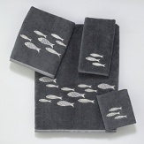 Luxurious sheared velour towel is embellished with a school of embroidered silver metallic fish swimming across the towel. Finished with a coordinating silver fabric trim.