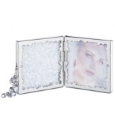 Make your memories shine even brighter with the travel-perfect Crystalline picture frame. A hinged design with a built-in mirror, Swarovski crystal chatons and a beaded tassel accent add new beauty to treasured moments.