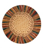 This round rug is ideal for open spaces. A polka dot pattern against a subtle creme background creates an abstract rug of rich, artistic beauty. A vivid, swirling border in a color palette that includes beige, burgundy, lavender and beige completes the rug with a resplendent finish. Hand-tufted and hand-carved of plush wool.