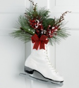 Hang up your skates. With frosted accents and a fresh holiday bouquet, this classic boot offers a whimsical expression of the season.