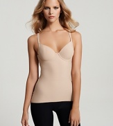 This cami provides a sleek and smooth fit and features a longer back panel so it won't ride up. Adjustable straps.