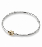 Mixed metals look chic on Pandora's sterling silver bracelet with a 14K gold signature clasp.