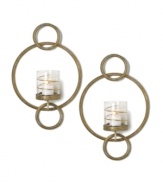 Equal parts wall art and lighting solution, each Symphony Ring sconce by Mikasa glows with whimsical splendor. Featuring rings of goldtone metal and glass candle holders wrapped in shimmering ribbons.