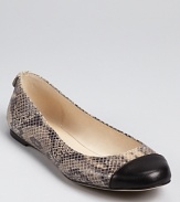 A sleek and smooth cap toe finishes a snakeskin-embossed silhouette from MICHAEL Michael Kors, a timelessly chic style for the endlessly chic.