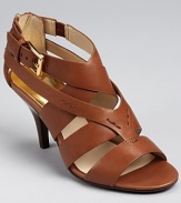 Sleek and strappy, these sophisticated sandals from MICHAEL Michael Kors boast gleaming hardware and a logo zipper pull.