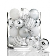 A favorite from one year to the next, Kurt Adler's shatterproof ball ornaments mix stripes and swirls of glitter with matte and shiny finishes, all in elegant silver.