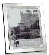 Engraved for timeless style in stainless steel and silver plate, the Watchband picture frame from Lauren Ralph Lauren is a sleek accessory for polished decor.