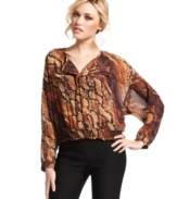 Animal attraction: a lush and earthy snakeskin-print provides ample cool to this blouson-style top from XOXO.