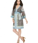 A beautiful print lends an elegant and unique touch to this kimono-inspired dress from ECI.