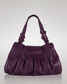 Cole Haan's leather satchel is a versatile fall addition. Sized to go from day-to-date night, this ladylike style softens sleek suits, trousers and blazers.