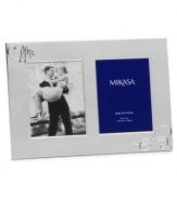 Show your romantic side. Loopy hearts in this silver-plated Love Story picture frame showcase a special moment or two with elegant whimsy. From Mikasa.