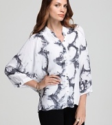 The classic dress shirt gets a contemporary update as sheer styling and abstract tie-dye infuse this XCVI blouse with modern edge.