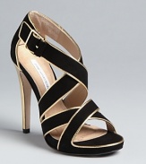 These DIANE von FURSTENBERG sandals play well day or night, with strappy uppers highlighted in gold.