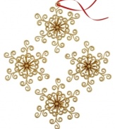 Swirl away. Give your tree that extra-special glimmer with the luminous golden sparkles and sweet design of these Swirl Snowflake ornaments.