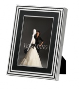 Add new elegance to beautiful memories with Vera Wang's With Love Noir picture frame. Geometric detail lends metallic shimmer to chic black enamel in a home accent that invokes modern and deco design.