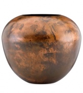 Finished by fire, each Burnished Copper vase is an individual. Rich earth tones and a unique mottled design distinguish the sculptural vessel for modern settings. By Donna Karan Lenox.