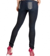 Snakeskin design at the back pockets lends animalistic attitude to these classic, dark wash skinny jeans! From GUESS?.
