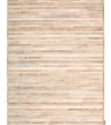 Western chic. Invite sumptuous style into your home with the one-of-a-kind Prairie rug from Calvin Klein. Tonal bars of rich cowhide are hand-tufted in an alternating pattern to create a stunning, mosaic-like appearance and a divinely textured feel.