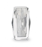 Masculine in its bearing, the Louxor vase by Baccarat creates an impressive statement wherever it is displayed. Designed with cuts specifically to maximize refraction and clarity of the high-quality crystal, its elegance is unparalleled.